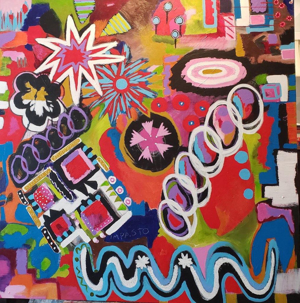 Explosions of color, predominantly shades of pink, then blue, with white circles in a chain and a ribbon of blue, black and white with small stars in the foreground and geometry surrounding.