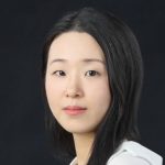 Author photo of Suphil Lee Park: She looks at the camera with a small smile, soft dark hair falling past her shoulders, down her white shirt. She's in front of a black background.